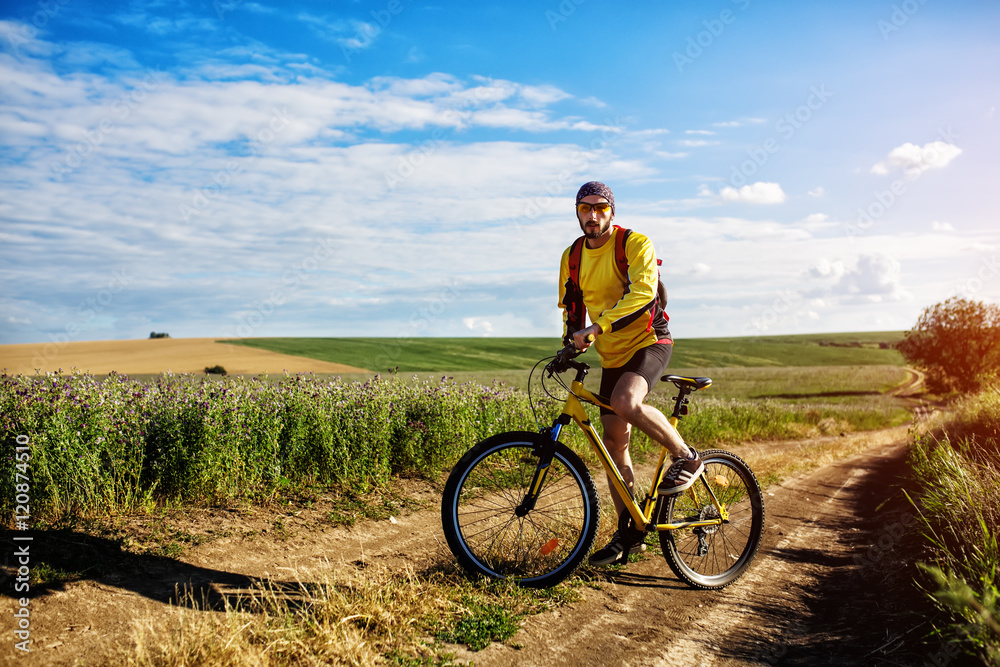 young bright man on mountain bike young bright man on mountain bike