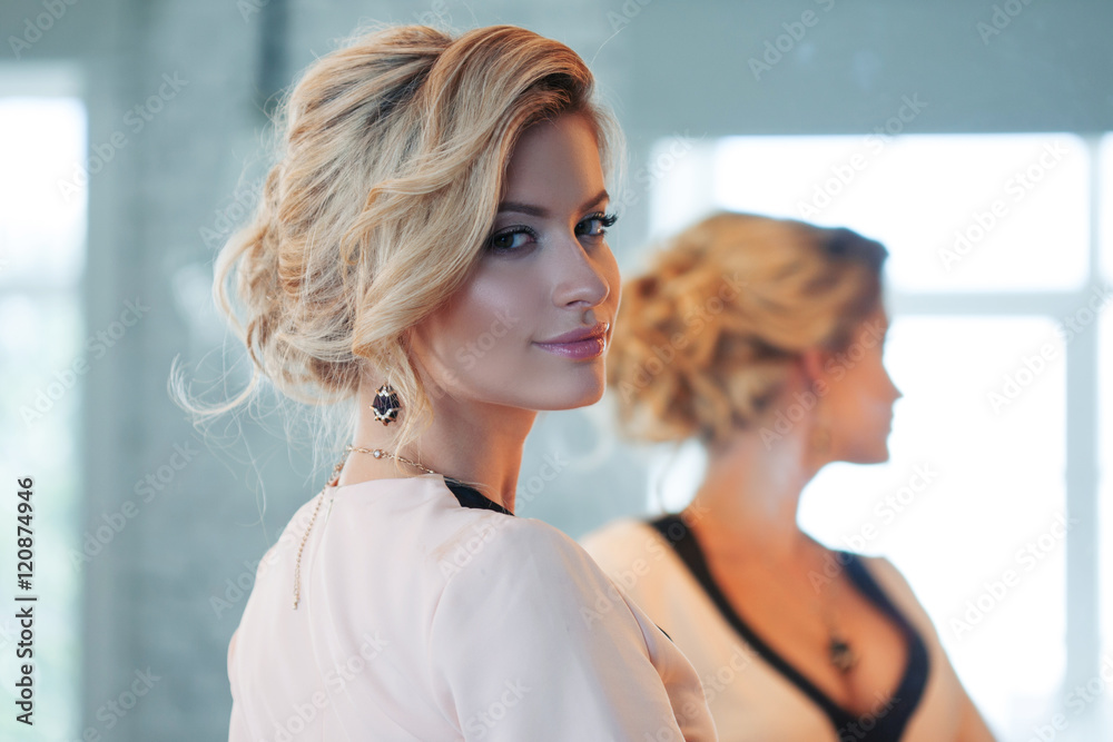 Fototapeta premium Fashion model with blond hair. Young attractive woman