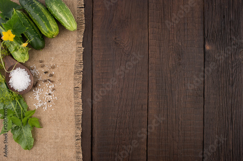 Fresh cucumbers on the old wooden table.