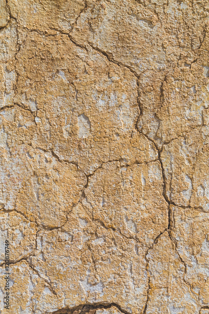 Cracked light beige coloured background texture Cracked light beige coloured background texture