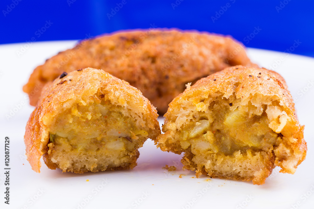 Indian food - vegetarian bread roll with stuffed potatoes Indian food - vegetarian bread roll with stuffed potatoes