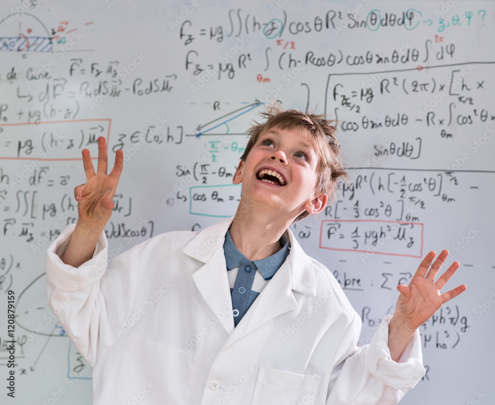 young funny genius posing in front of a board wiht math calculs young funny genius posing in front of a board wiht math calculs
