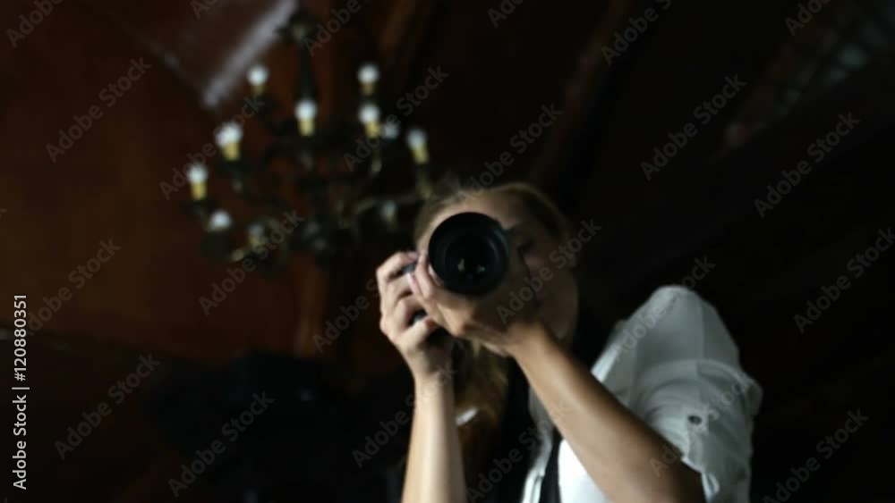 Attractive photographer working in studio Attractive photographer working in studio