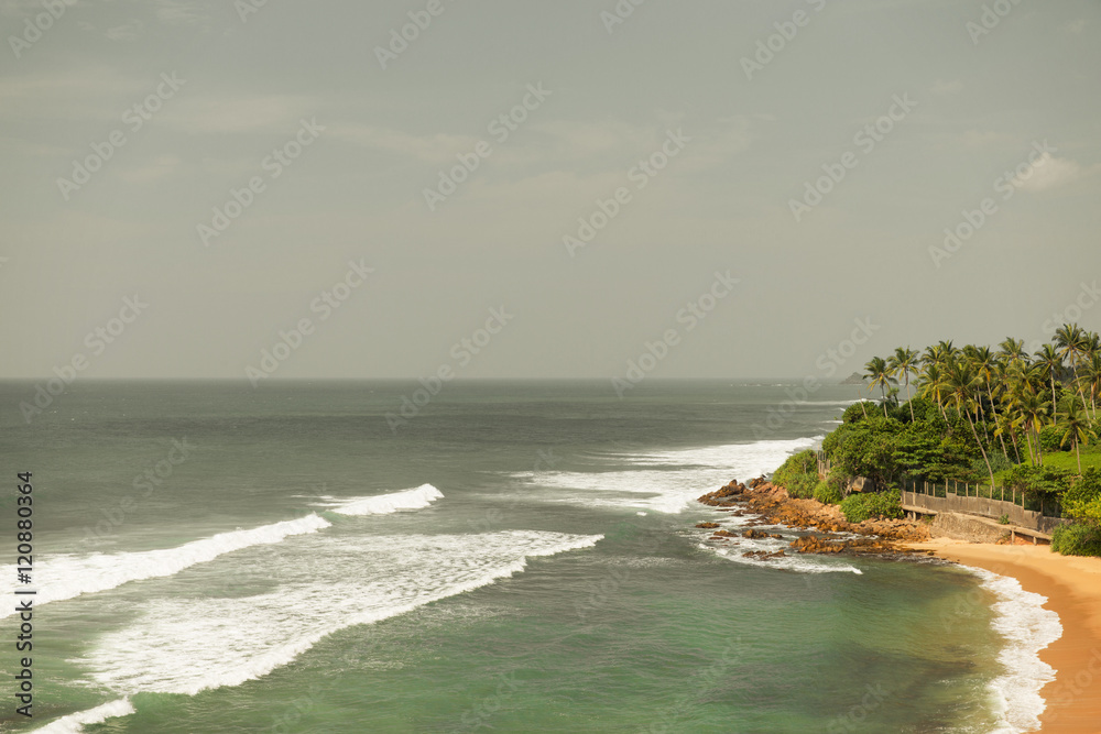 sea or ocean waves and blue sky on Sri Lanka beach