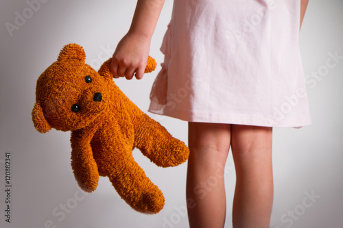 
little girl with her teddy bear