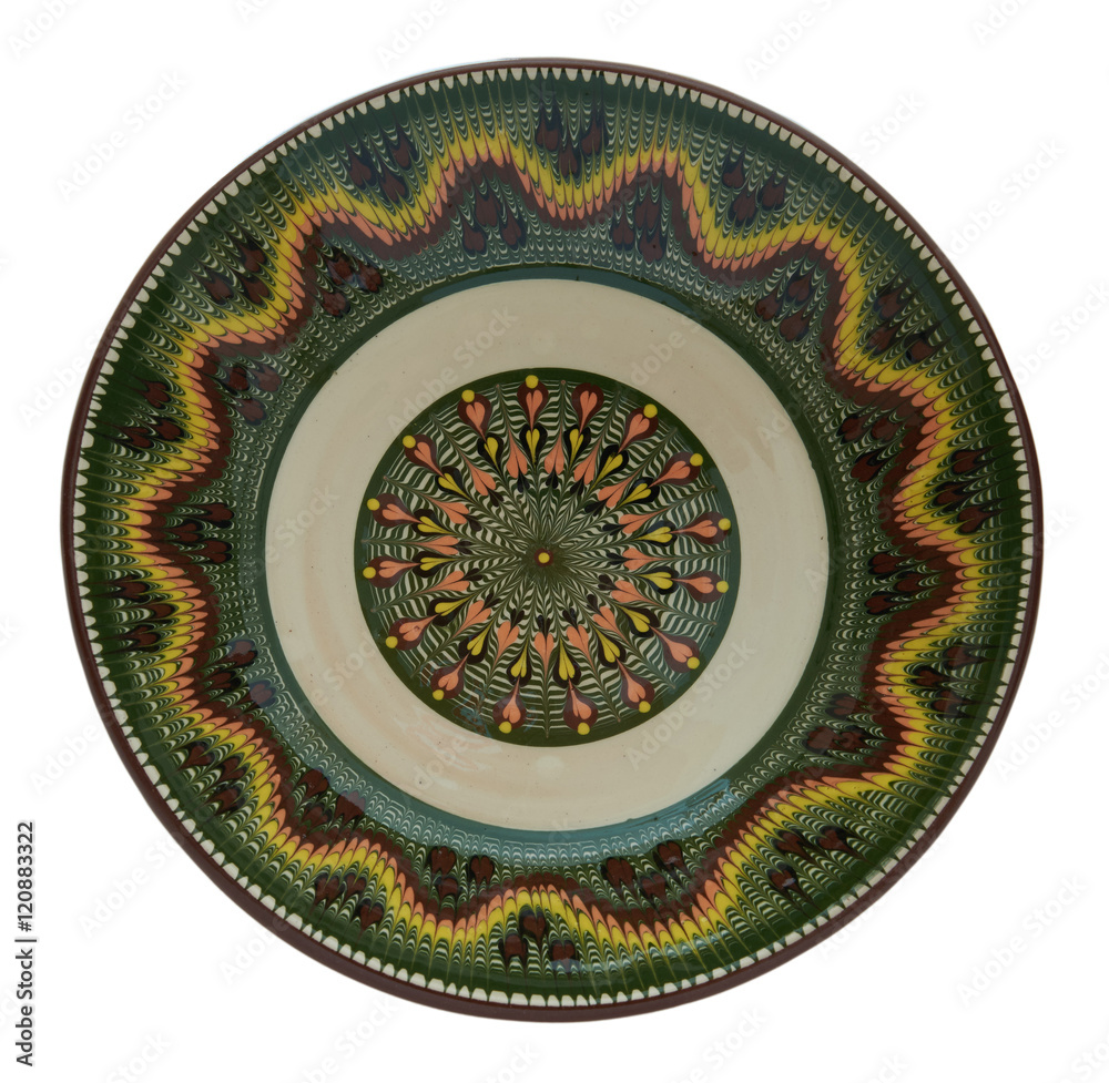 Ceramic plate painted in flanders technology on a white backgrou