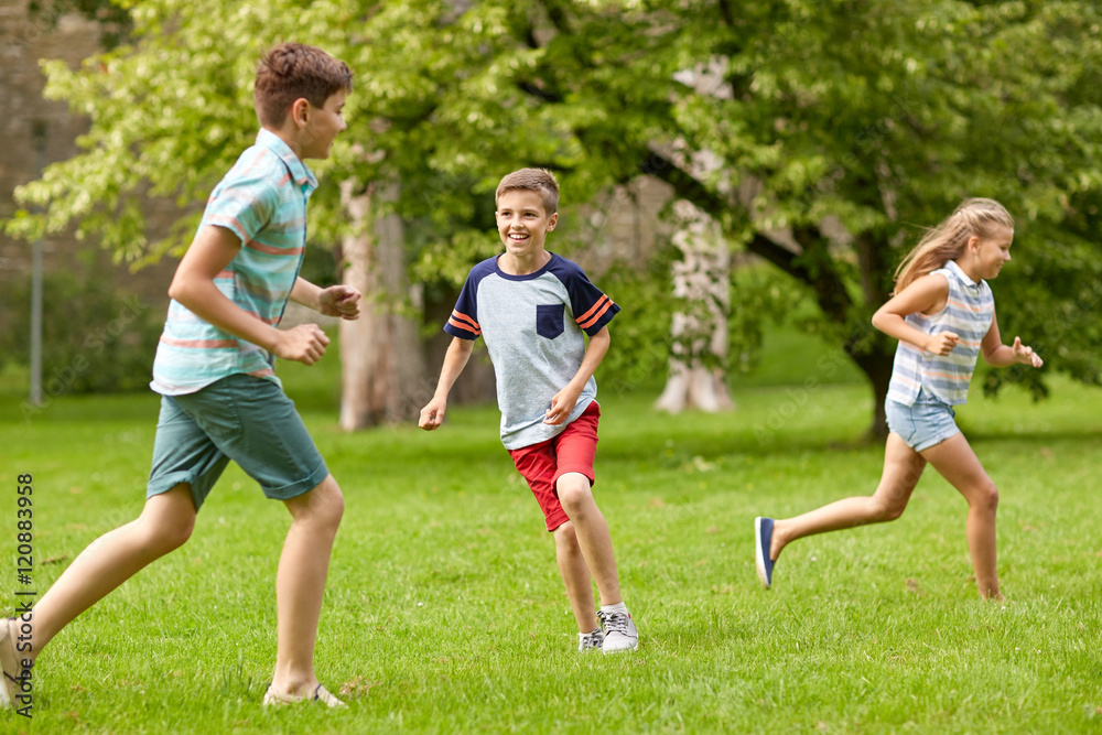 happy kids running and playing game outdoors happy kids running and playing game outdoors