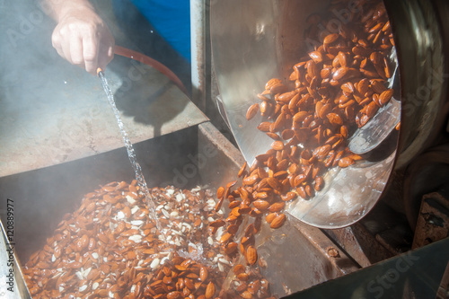 Картината върху платно Shelled almonds just after the blanching process ready for the peeling phase