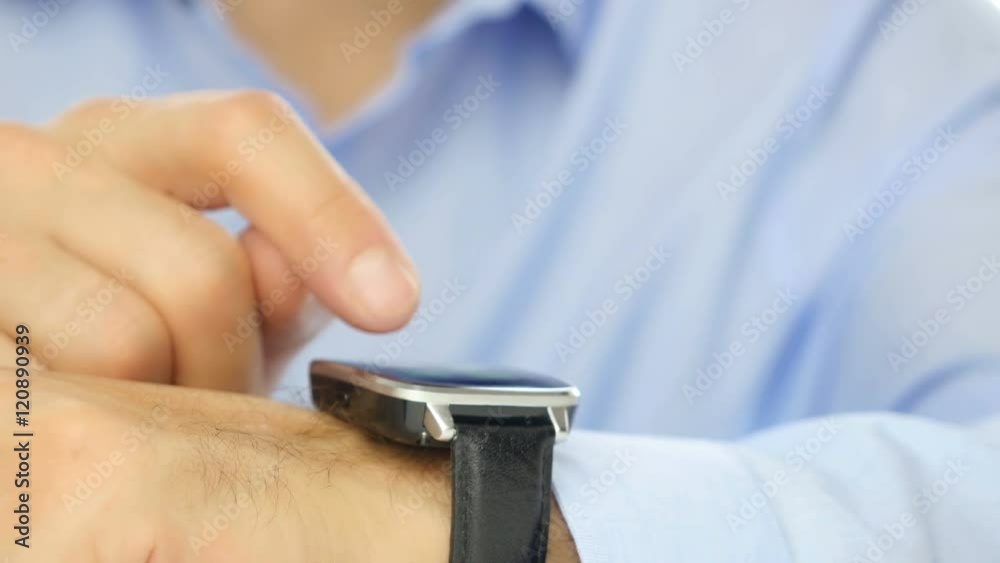 Man using his smart watch device. Close-up hands.
Man using his smart watch device. Close-up hands.