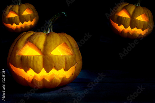 three halloween pumpkins head jack in party night
