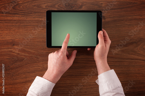 Business hands holding tablet