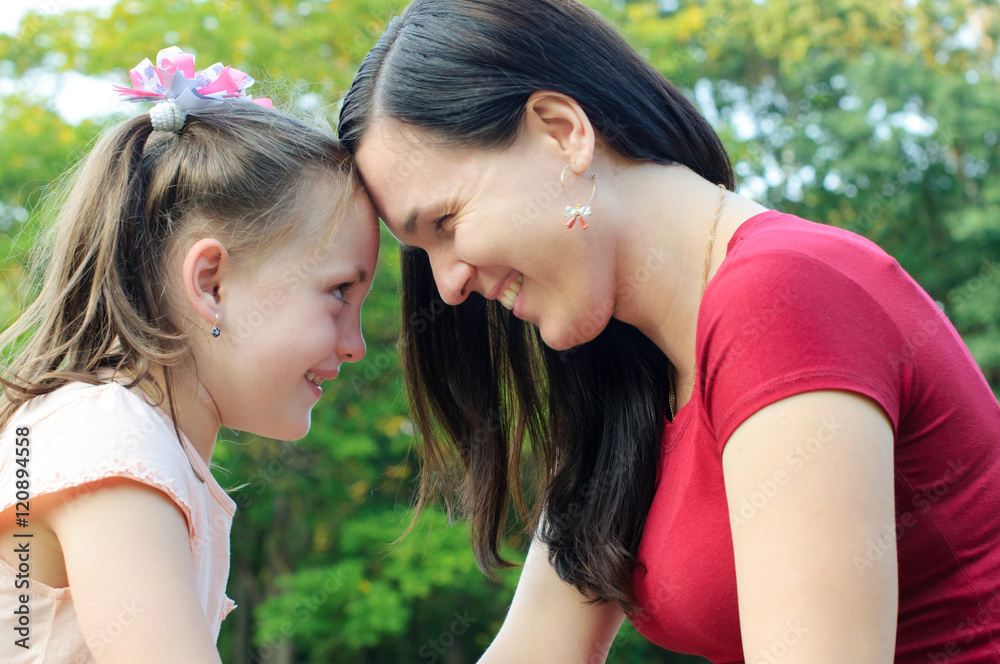 Mother with daughter having fun in the park Mother with daughter having fun in the park