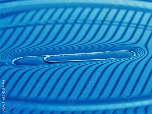 Surface tension - paperclip on water surface macro, in striped lighting, not photoshopped, simple physics