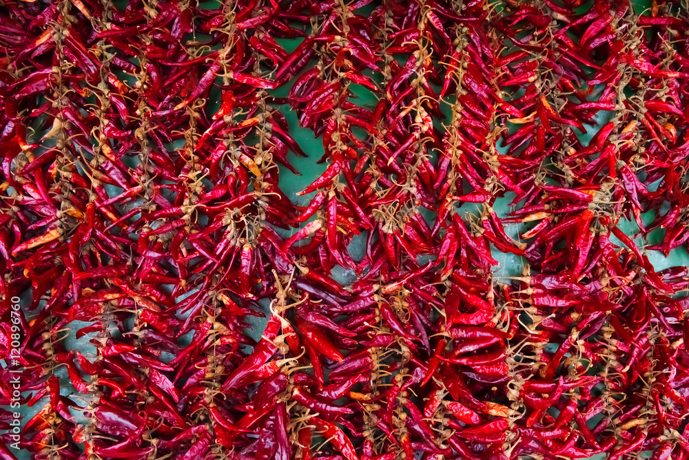 Background of colorful red and green bell peppers over wooden ba