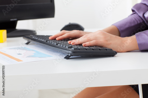 woman hands typing on keyboard