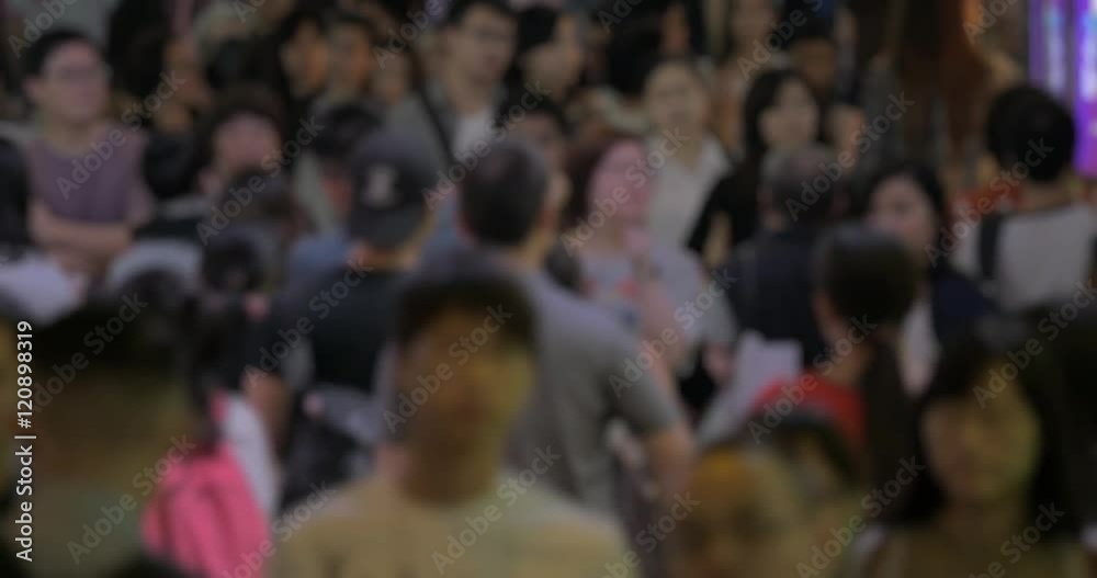 Defocused shot of people traffic on Hong Kong street. Crowd in the metropolis, faces unidentified Defocused shot of people traffic on Hong Kong street. Crowd in the metropolis, faces unidentified