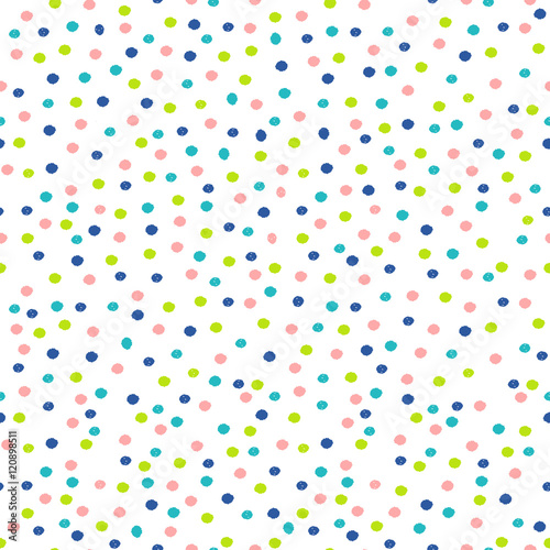 Abstract seamless pattern with dots in pastel pink, blue and green.