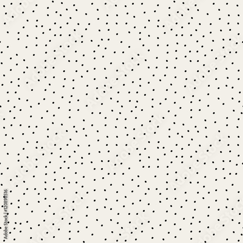 Seamless repeat pattern with hand drawn dots in black on white background.