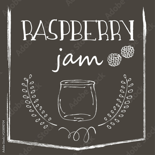 Chalkboard with jar of raspberry jam and raspberries, laurels and frame