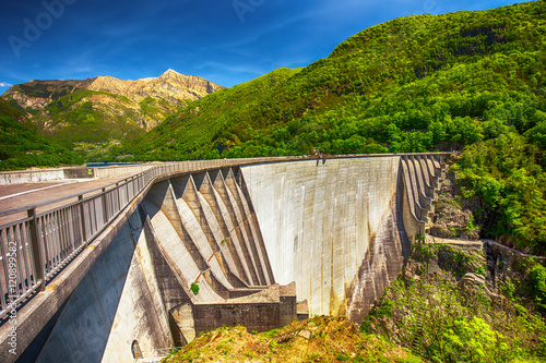 Dam of Contra Verzasca Ticino, Switzerland. The dam creates a water reservoir Lago di Vogorno. It is famous place for bungee jumping and place where some scenes of James Bond movie was taken place. photo