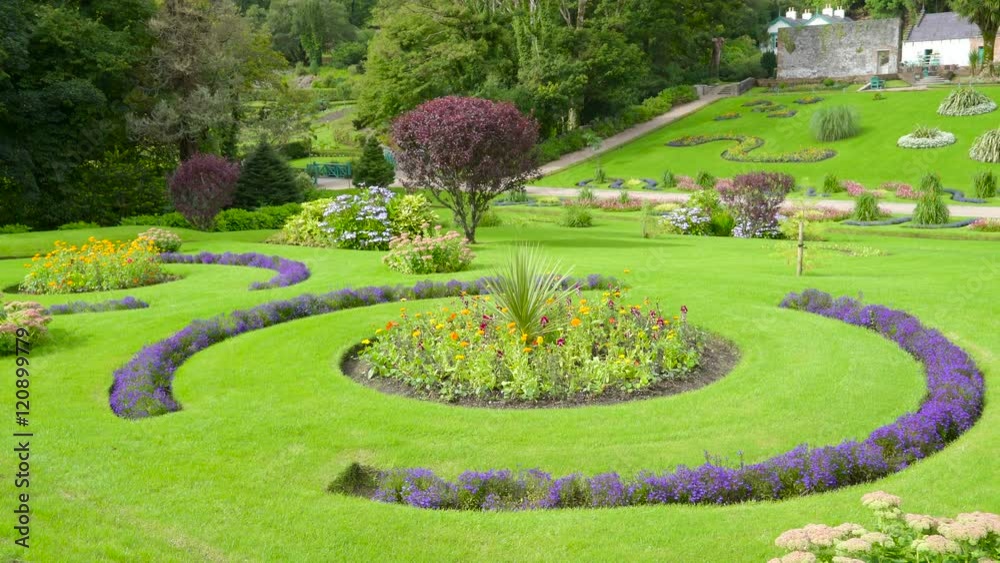 The grass landscapes on the garden in Kylemore Abbey with the pretty plants on the garden in Ireland The grass landscapes on the garden in Kylemore Abbey with the pretty plants on the garden in Ireland