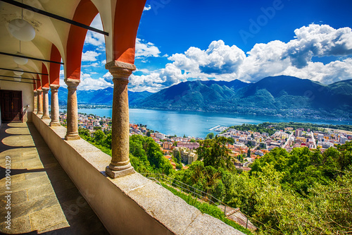 Beautiful view to Locarno city, lake Maggiore (Lago Maggiore) and Swiss Alps from Madonna del Sasso Church in Ticino, Switzerland. photo