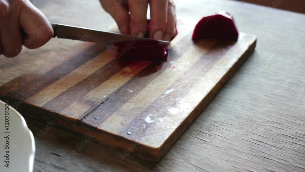 Cutting beet on a board chef cooking Cutting beet on a board chef cooking