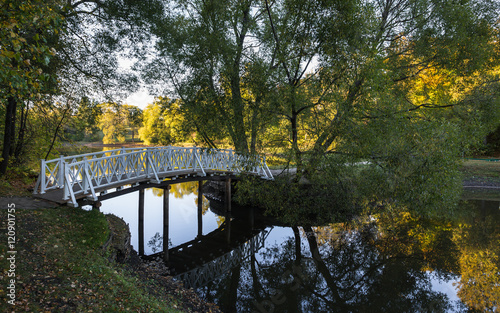 The bridge over the water. Evening in autumn park of Lermontov's estate, Russia. photo