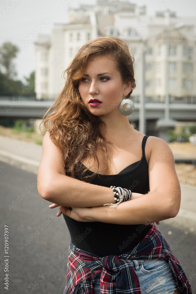 Young girl dancing regeton on a city street Young girl dancing regeton on a city street