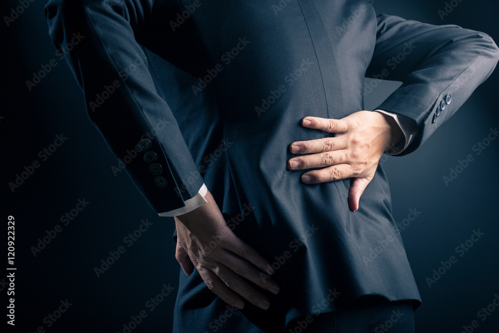 Businessman has waist ache