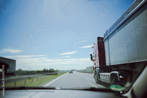 traffic on the freeway with cars and trucks overtaking