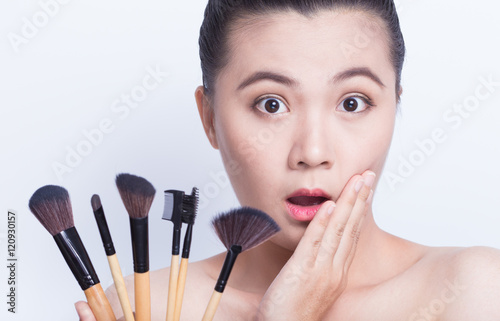 Beauty shot of woman holding the makeup brush