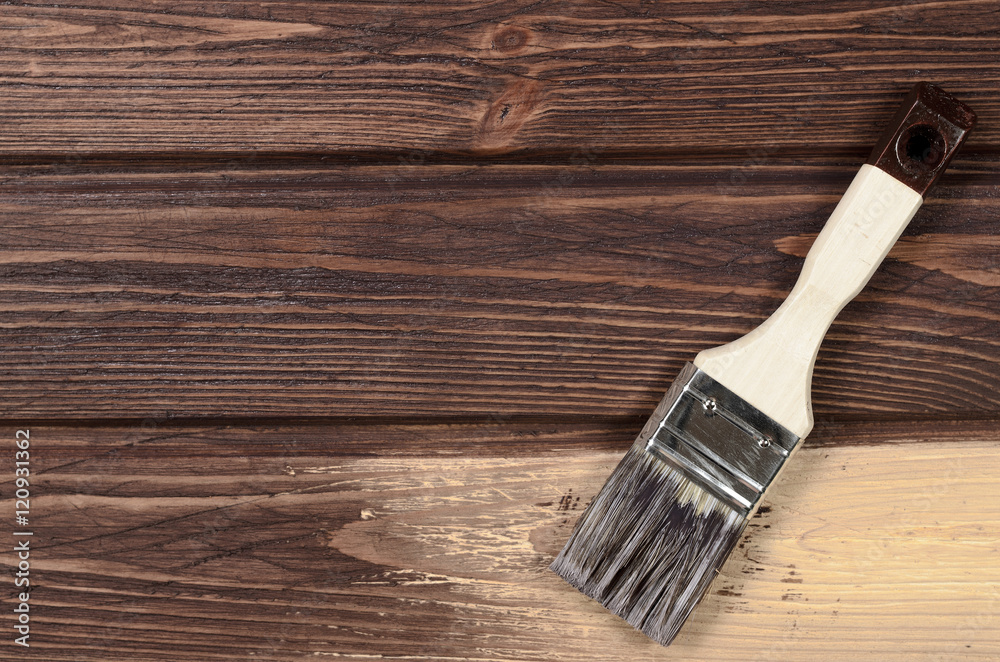 The process of painting wood surfaces with a brush. Unfinished p The process of painting wood surfaces with a brush. Unfinished p
