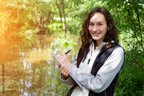 Young attractive biologist woman working on water analysis