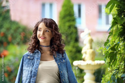 Beautiful young girl in garden