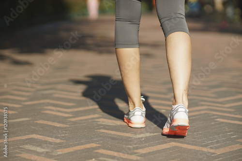 closeup of female walking legs after jogging