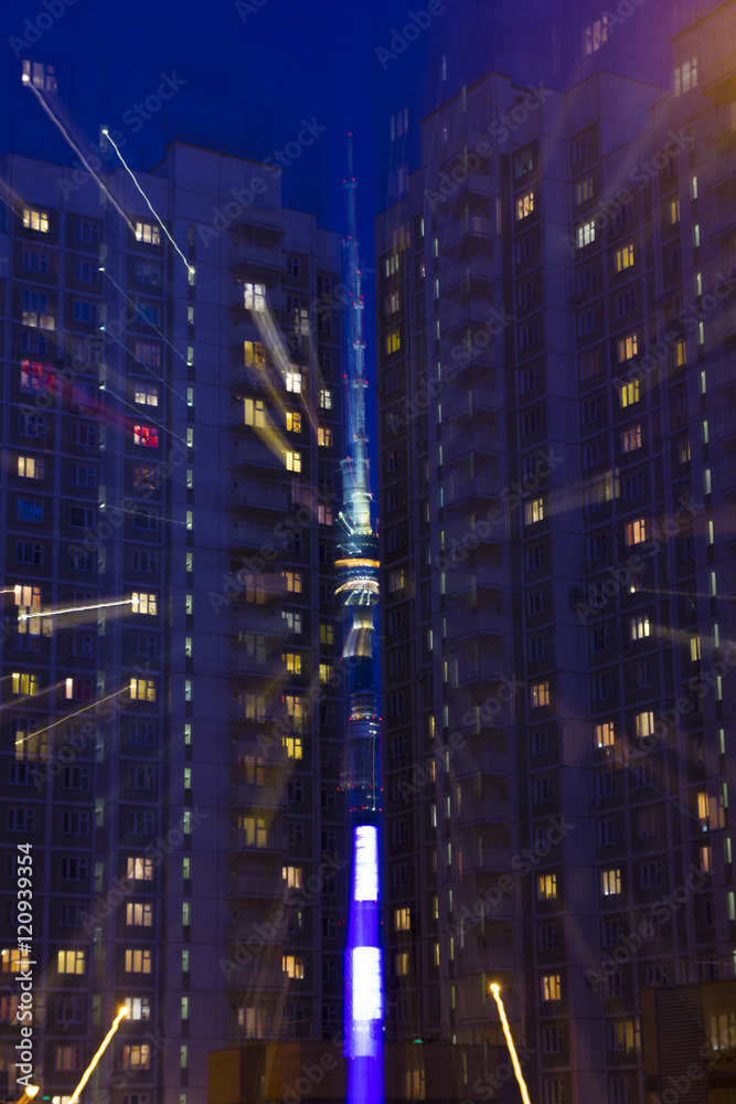 Fototapeta premium Ostankino tower between the houses