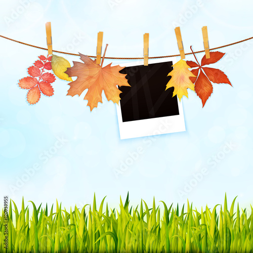 Nature background with grass, photos on rope and autumn leaves v