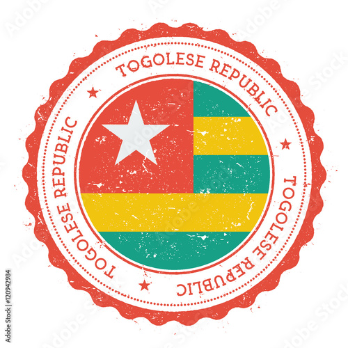 Grunge rubber stamp with Togo flag. Vintage travel stamp with circular text, stars and national flag inside it. Vector illustration.