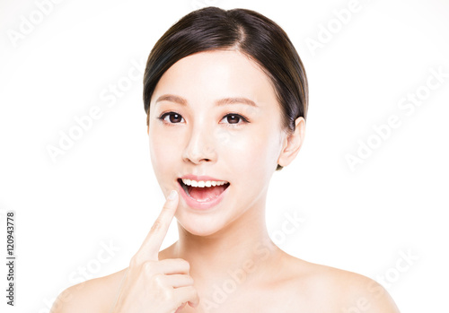 beautiful young woman showing her teeth