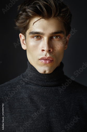 Portrait of handsome guy with hair.