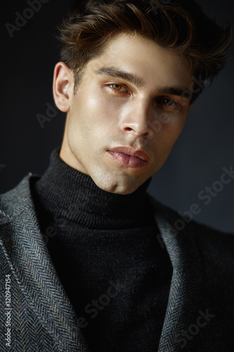 Portrait of handsome guy with hair.