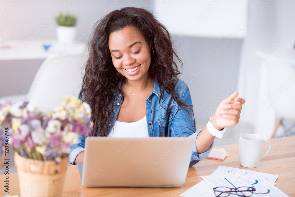 Cheerful woman using laptop Cheerful woman using laptop