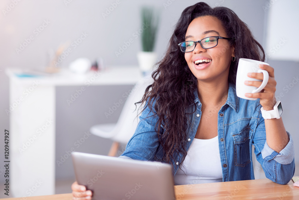 Cheerful delighted woman resting at the table Cheerful delighted woman resting at the table