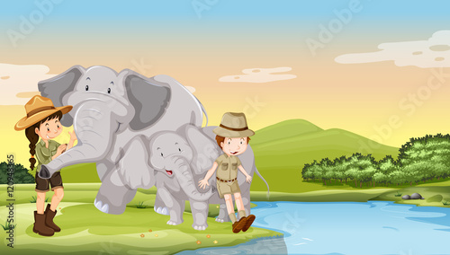 Kids and elephants by the river