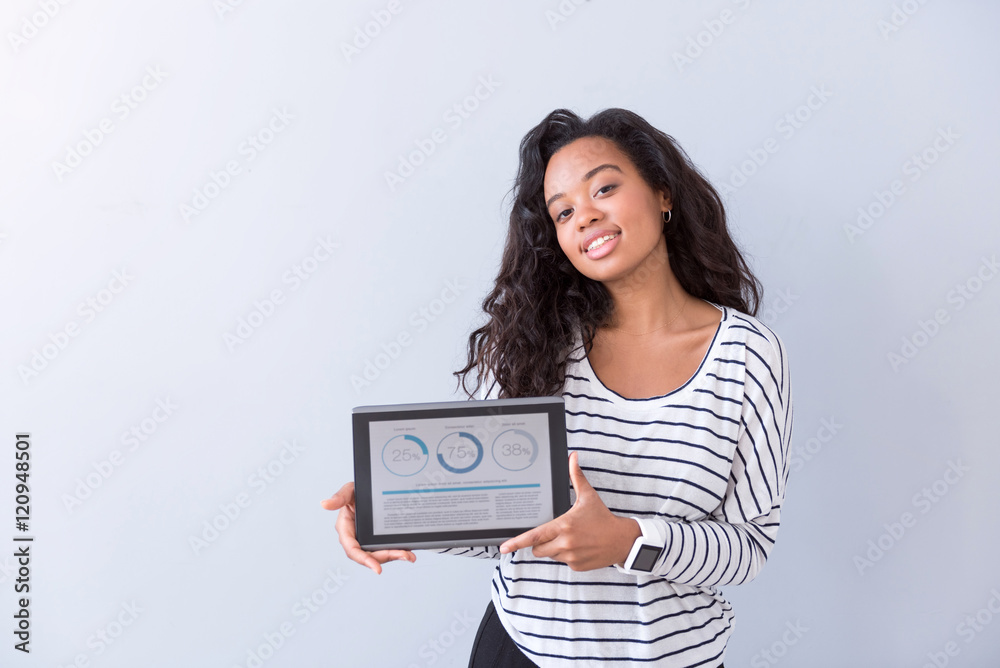 Cheerful woman holding tablet Cheerful woman holding tablet