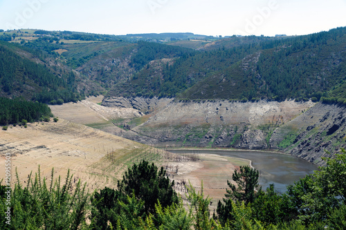 Landscapes of . Ruins of the village of Chave  normally submerged   strains and terraces of vineyards in the Ribeira Sacra   Galicia  Spain
