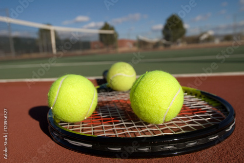 Tennis balls, court and racquet