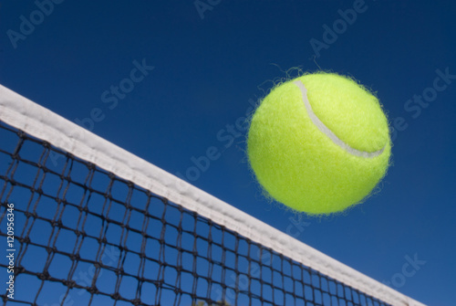 Tennis ball and net © cherylvb