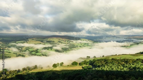 Timelapse sequence of morning misty valley in Peak District National Park